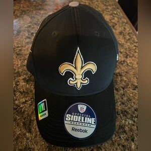 This New Orleans Saints cap is a Reebok Official Sideline Headwear model.